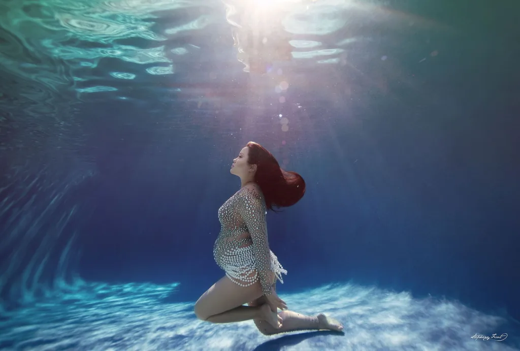 Underwater maternity photo session experience by Stephany Ficut Photography in crystal gown