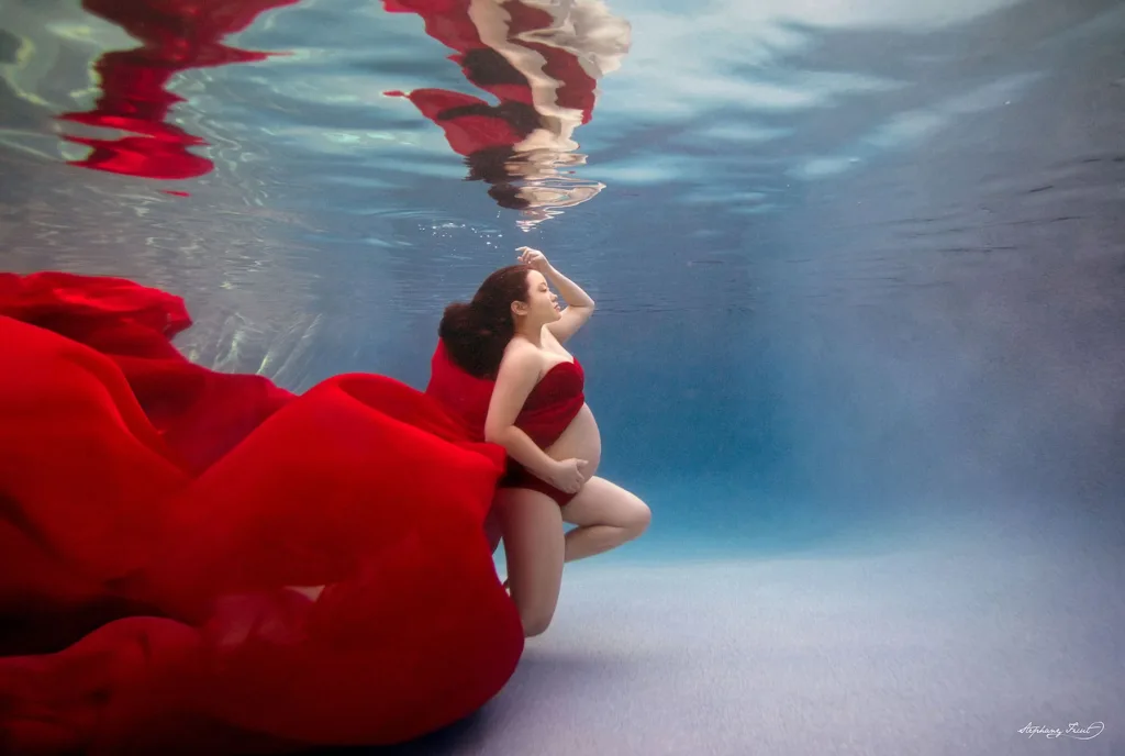 Underwater maternity photo session experience by Stephany Ficut Photography in red gown