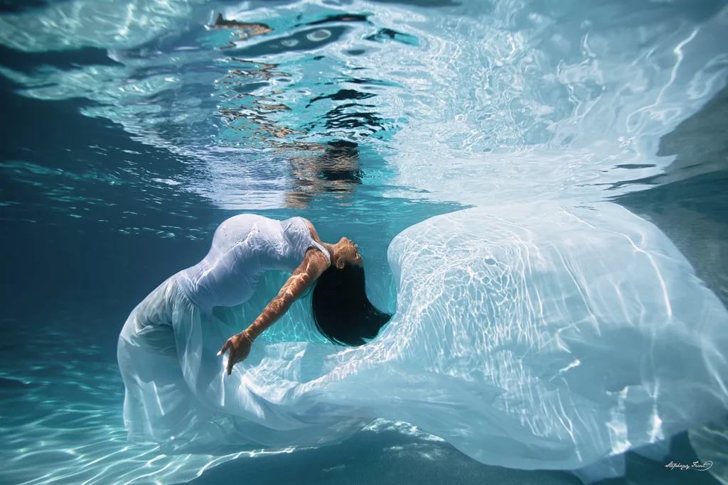 Underwater maternity photo session experience by Stephany Ficut Photography in white gown